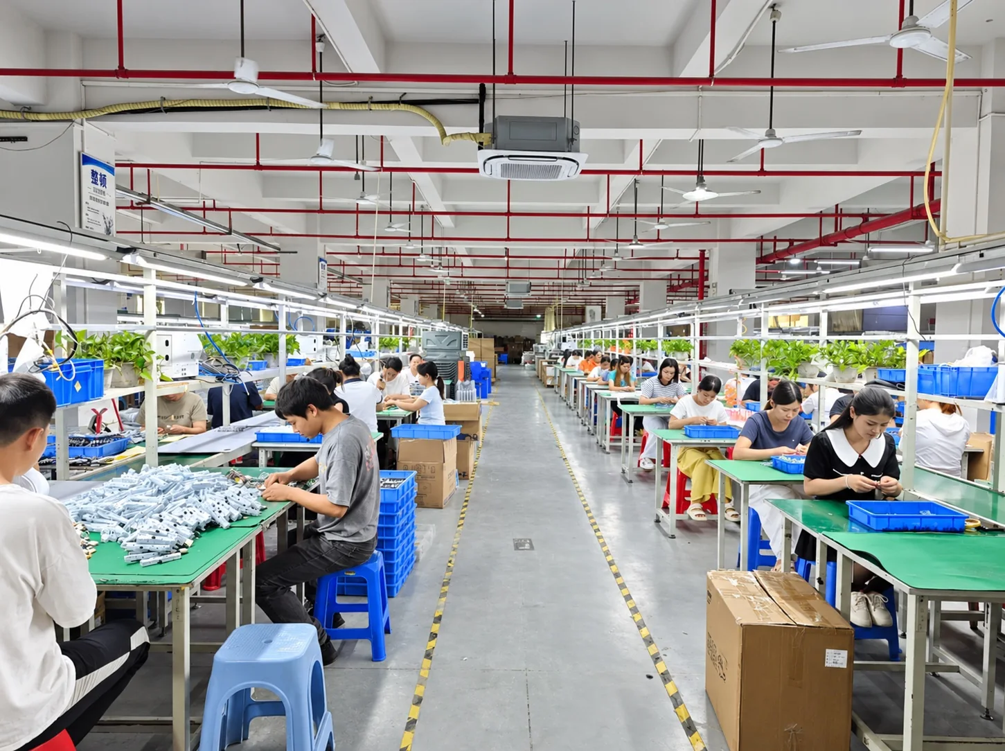 Assembly workstations at HOLYTACHI in Dongguan